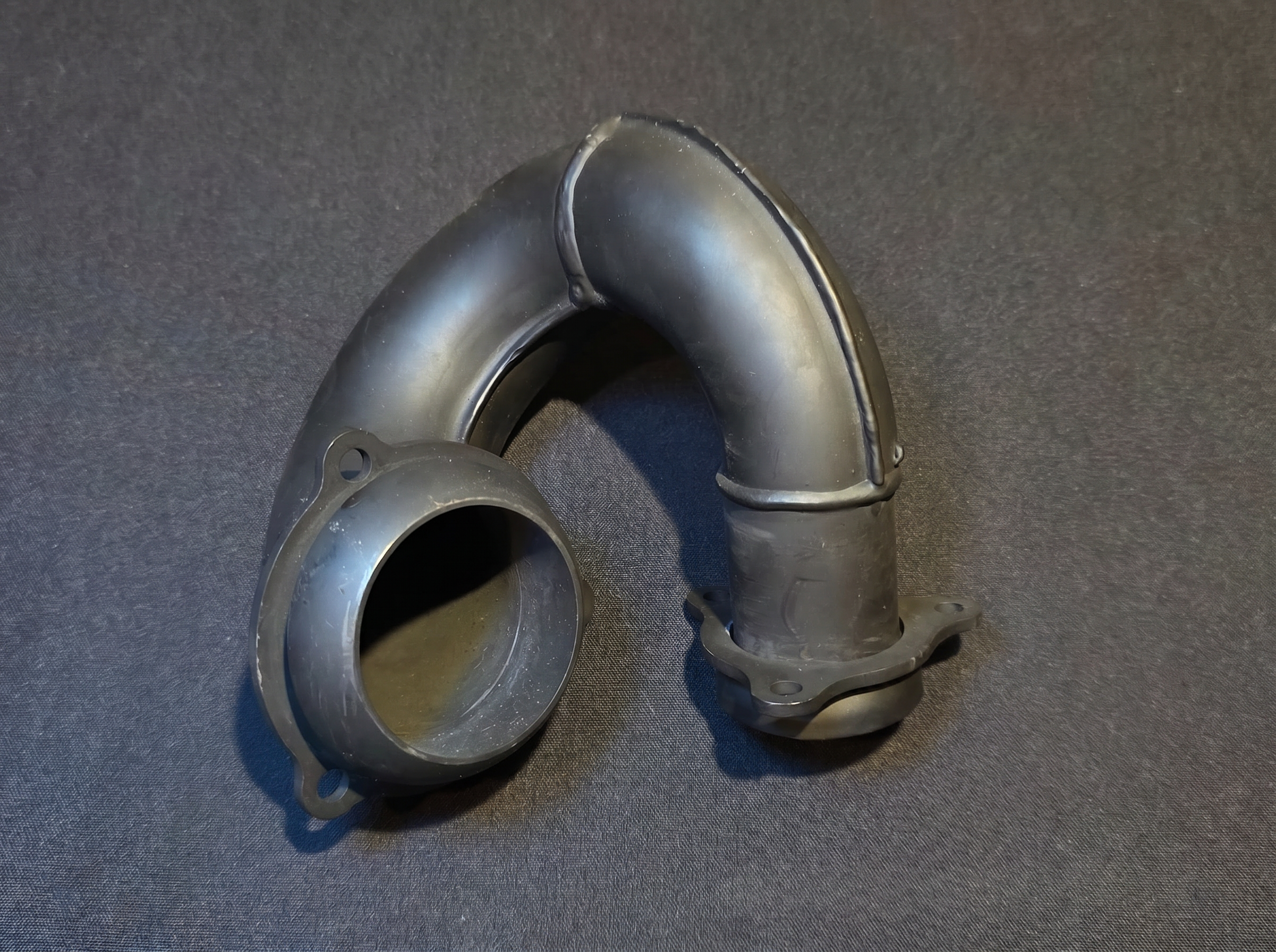 Matte black high-temp coated exhaust elbow header pipe for HE Paramotors engines with mounting flange