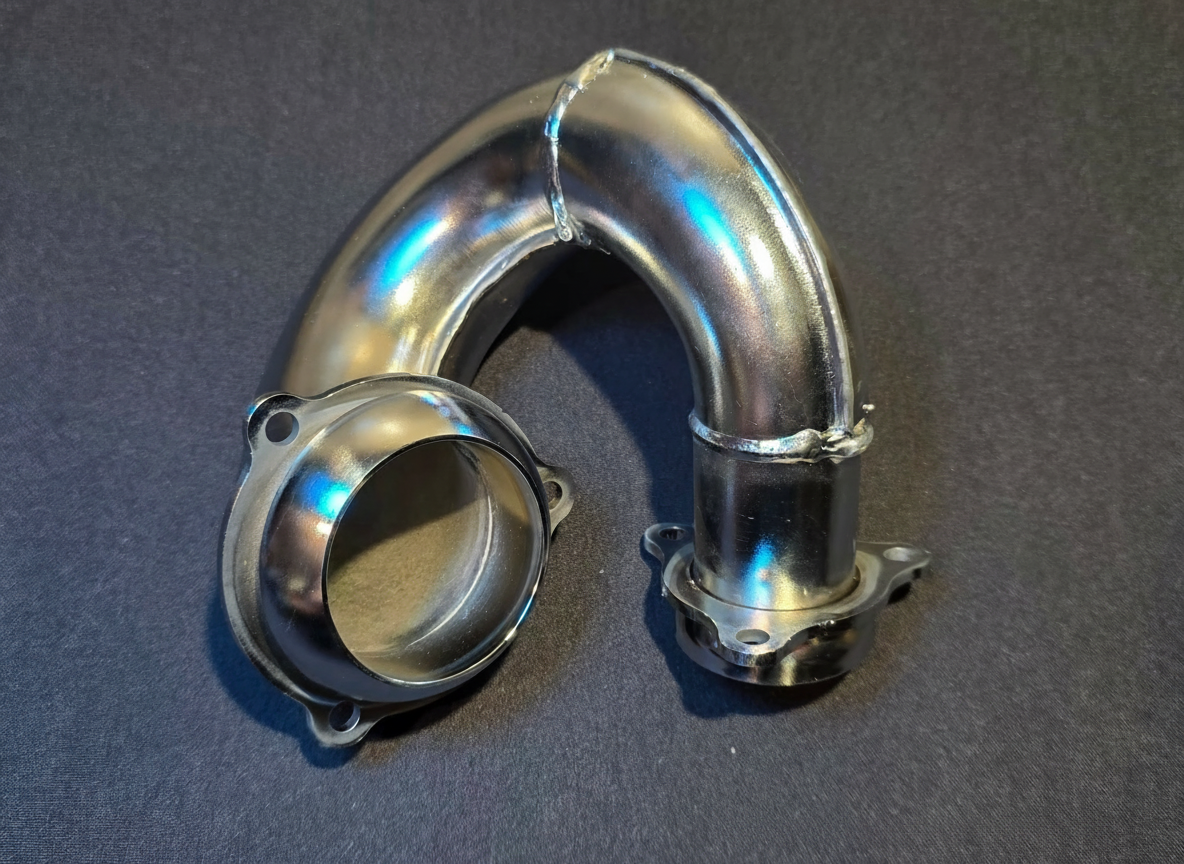 Polished chrome exhaust elbow header pipe for HE Paramotors engines with mounting flange