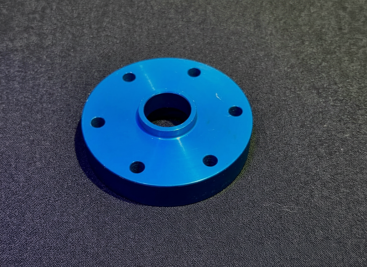 Anodized blue aluminum propeller spacer with six-bolt pattern for HE Paramotors reduction drive