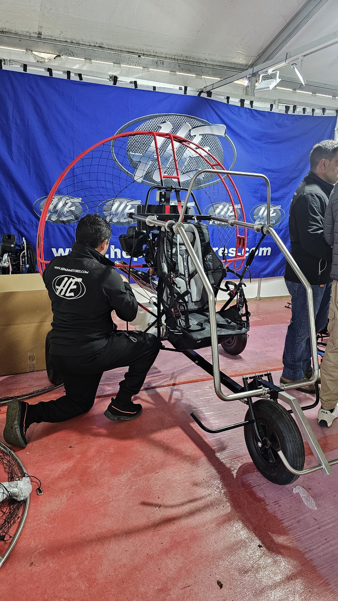 HE paramotor trike being assembled at an HE Paramotors event