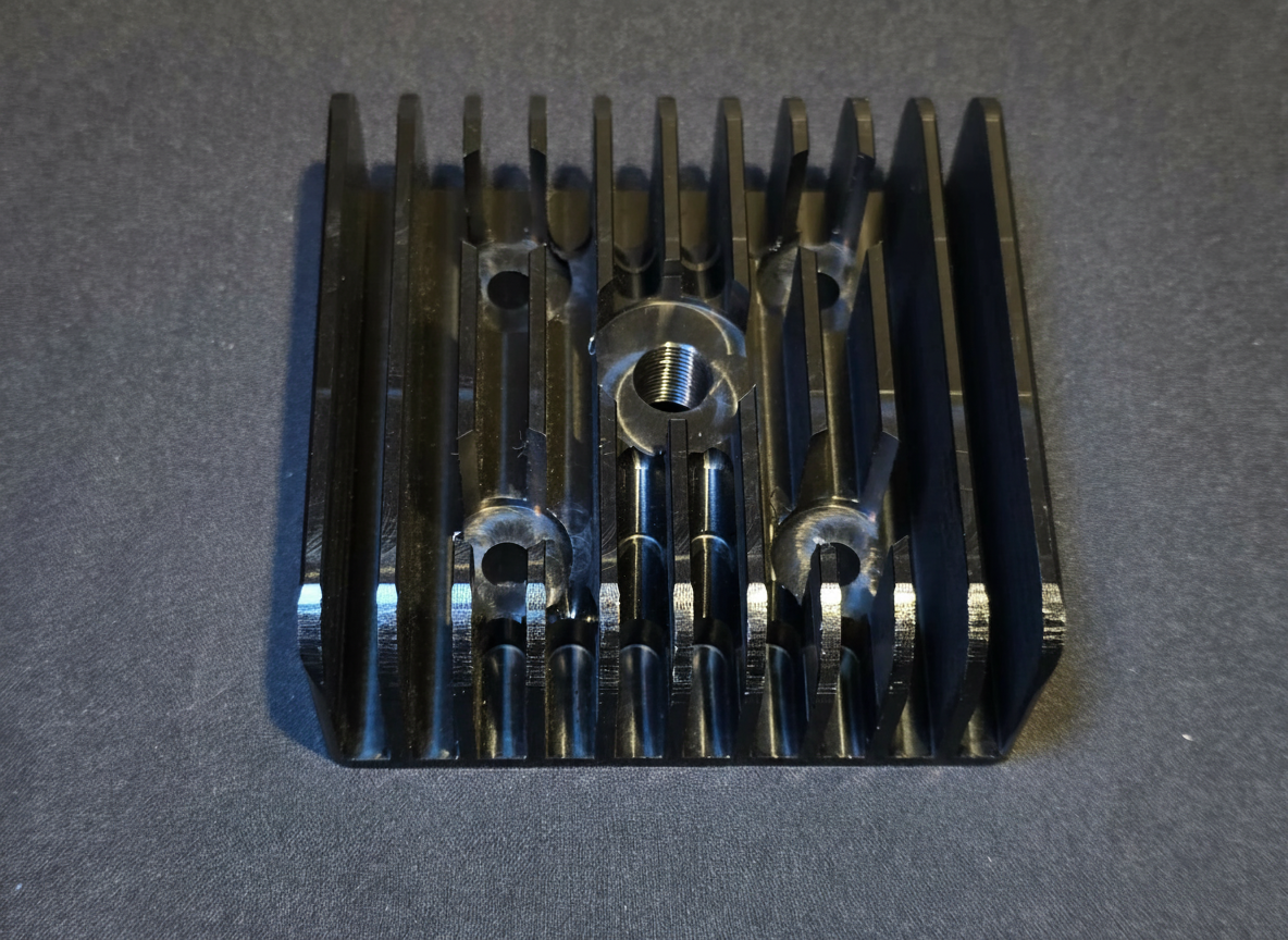Black anodized finned cylinder head for HE Paramotors MVL 125 two-stroke engine